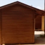 Arkası olarak çekilmiş bahçe depolama evi görseli